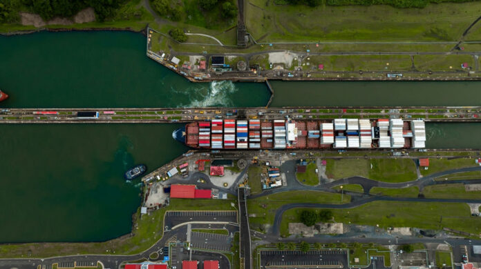 Aerial view of a ship in a canal lock