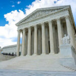 SHOCKING Turn: No Mental Evaluation for Rihanna Shooter White building with columns under a blue sky.