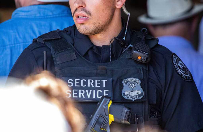 Secret Service officer wearing tactical gear and radio.