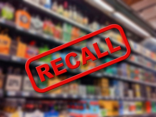Recall text overlay on blurred store shelves background.