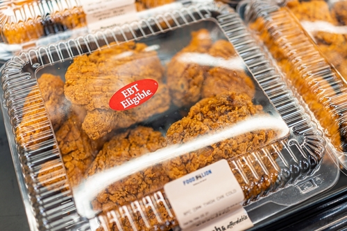 shutterstock_2035733930.jpg Packaged fried chicken in a grocery store with EBT eligibility label