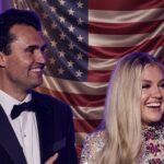 Bomb Threat SHOCKER: Plot Against Erika Kirk Shocks Nation… A smiling couple in formal attire standing in front of an American flag backdrop