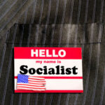 Name tag reading Hello, my name is Socialist.