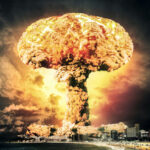 Massive mushroom cloud over a coastal city skyline