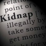 Dictionary entry for the word kidnap in close-up