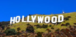The Hollywood sign on a hillside under a clear blue sky
