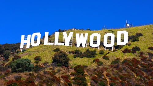 The Hollywood sign on a hillside under a clear blue sky
