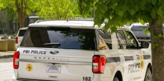 FBI police vehicle parked on a city street