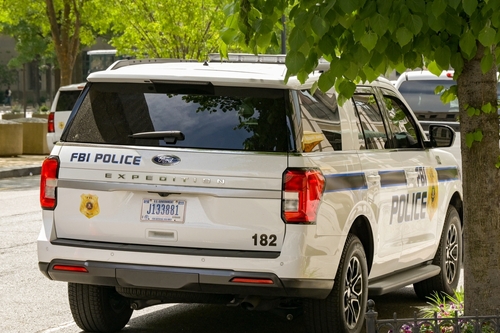 FBI police vehicle parked on a city street