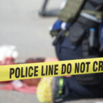 TEACHER DOWN, Campus Sealed — What JUST Really Happened? Police tape cordons off an active scene with responders in the background