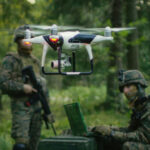 “Killer Robots” Spark Urgent UN Call for Global Ban Soldiers in a forest operating a drone.
