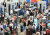 All D.C Flights GROUNDED After This Happened! Crowd at an airport security checkpoint with TSA officers.