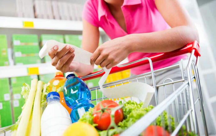 Person shopping for groceries in store.