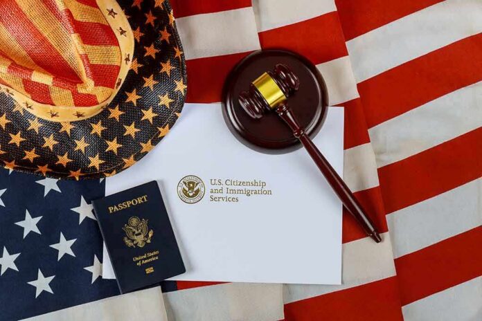 shutterstock_1806488143-1 U.S. passport, gavel, and USCIS document on American flag
