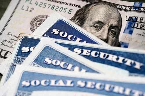 Several,Social,Security,Cards,On,A,Us,United,States,One Social security cards and a hundred dollar bill arranged together