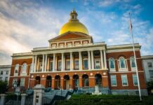 Program Created to Give Muslims Priority for State Jobs Massachusetts State House with golden dome and columns