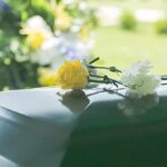 Troubled Hollywood Star Found Dead at 36 Yellow rose and white carnation on a green casket