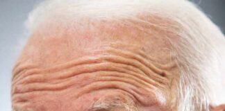 older man speaking in close-up portrait