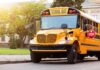 Yellow school bus with stop sign extended