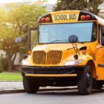 Parents Storm Bus to RESCUE Kids Yellow school bus with stop sign extended