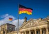 The Nazis are Back in Germany – Major Uprising German flag flying above the Reichstag building