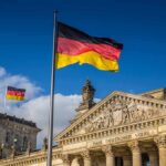German flag flying above the Reichstag building