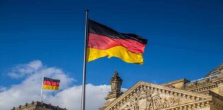 German flag flying above the Reichstag building