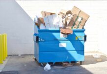 Mother Pleads Guilty – KILLED Newborn in Dumpster Blue dumpster overflowing with cardboard boxes