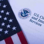 ICE Pepper-Spray, Punch Students Outside School American flag beside U.S. immigration document