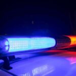 Pediatric Doctor Stabbed to Death in His Bed While His Children Slept Police car light bar flashing blue and red at night