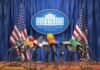 Press microphones at a White House briefing podium