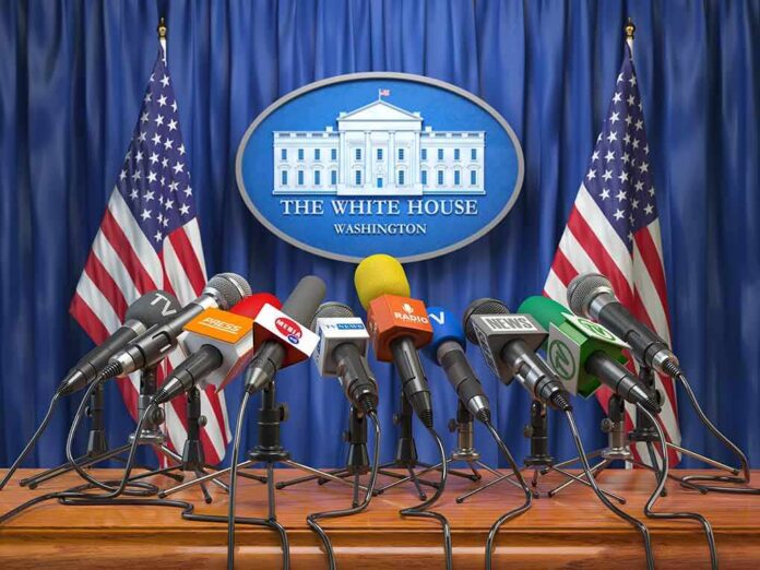 Press microphones at a White House briefing podium