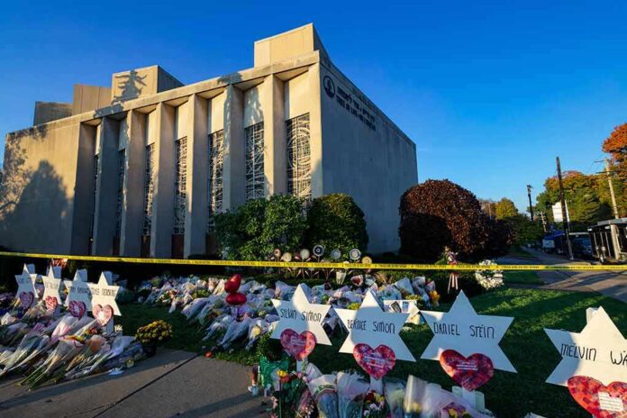 shutterstock_1216488064 Synagogue exterior with memorial flowers and star-shaped tributes on lawn