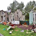 Senators Bodyguard ARRESTED – Wrecks Her Home Houses with significant storm damage and debris scattered around the yard