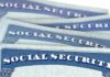 Social Security cards stacked in a close-up view