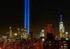 New York City skyline at night with twin blue light beams