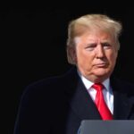 Trump Issues Protocol Should He Be Assassinated Donald Trump at a podium with a microphone