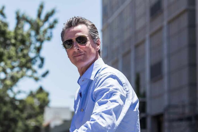 man in sunglasses wearing a light blue shirt outdoors