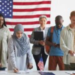 Muslim Candidate Vows To Follow Sharia in EVERYTHING He Does Voters standing in line at a polling station with a U.S. flag