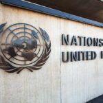United Nations emblem and signage on a concrete wall