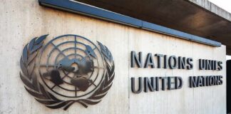 United Nations emblem and signage on a concrete wall