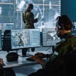 State of Emergency DECLARED – Chaos Rocks California Military analysts at computers in a command center