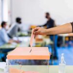 Wacky Marxist Concedes After Gubernatorial Primary Hand casting ballot into a box at a polling station