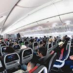 Israel Plane Hijacker REVEALED – He’s From Where?! Airplane cabin with passengers seated in economy class