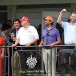 Republican Senator Breaks Ranks, Calls for Probe Into Don Jr Eric Trump, Tucker Carlson, and Donald Trump Jr. on a balcony at a golf club event