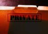 file folders labeled for patient health records marked private