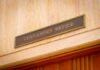 Woke Governor Sides WITH Teen’s Rapist Governor's Office sign above a wooden doorway