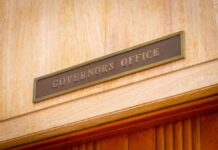 Governor's Office sign above a wooden doorway