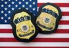 ICE badges on an American flag background