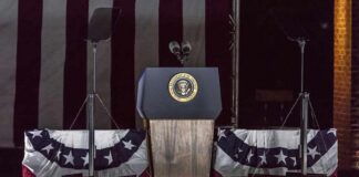 Presidential podium with microphones and teleprompters